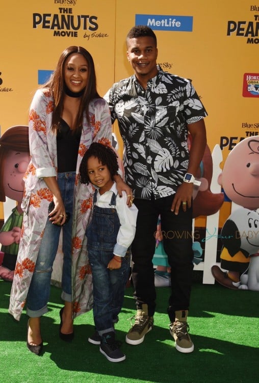 Tia Mowry and Cree Taylor Hardrict seen at the Premiere of 20th Century Fox's 'The Peanuts Movie' with their son