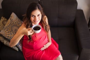 pregnant mom drinking coffee