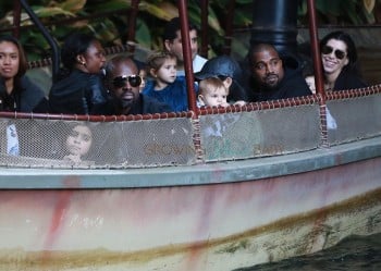 Kanye West and Corey Gamble at Disneyland with Reign and Penelope Disick
