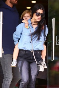 Penelope Disick gets a piggy back ride after a lunch at Lovi's with her mom Kourtney & dad Scott
