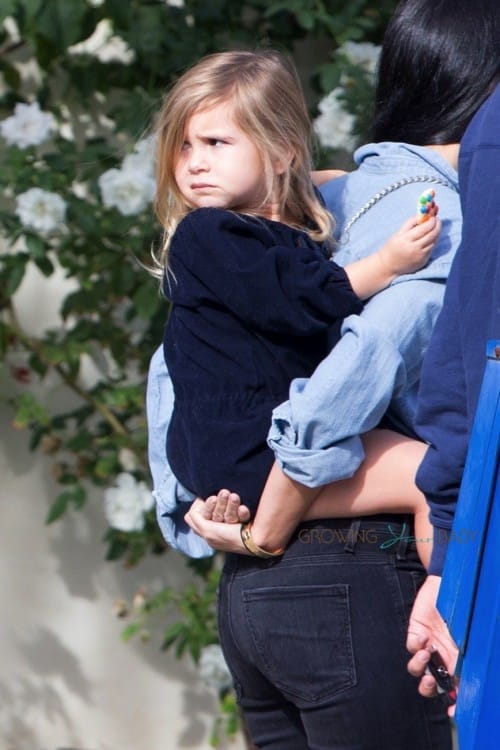 Penelope Disick gets a piggy back ride after a lunch at Lovi's with her mom Kourtney & dad Scott