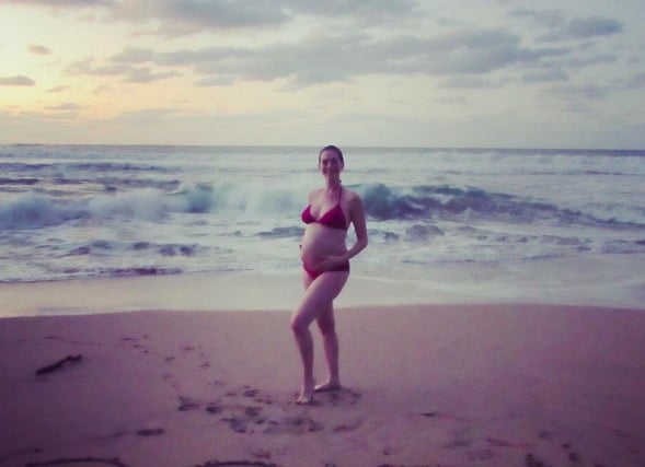 Pregnant Anne Hathaway on the beach