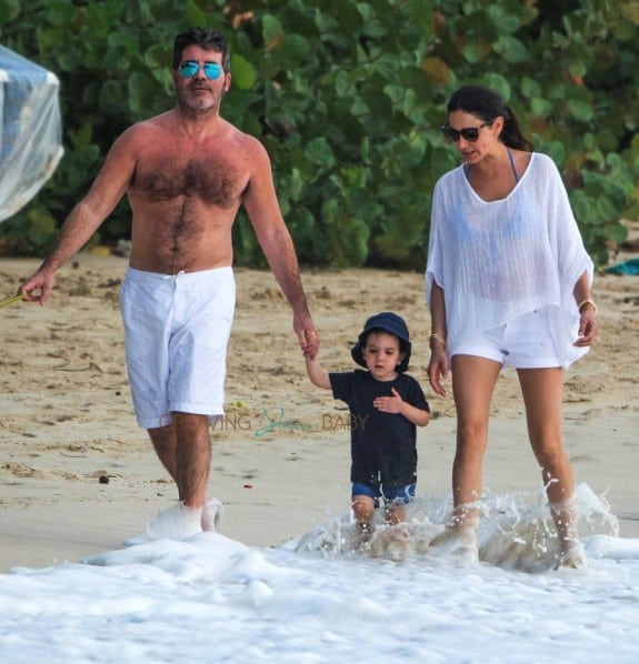 Simon Cowell and Lauren Silverman stroll on the beach with son Eric in Barbados