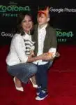 Lindsay Price walks the red carpet at the zootopia premiere