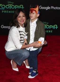 Lindsay Price walks the red carpet at the zootopia premiere