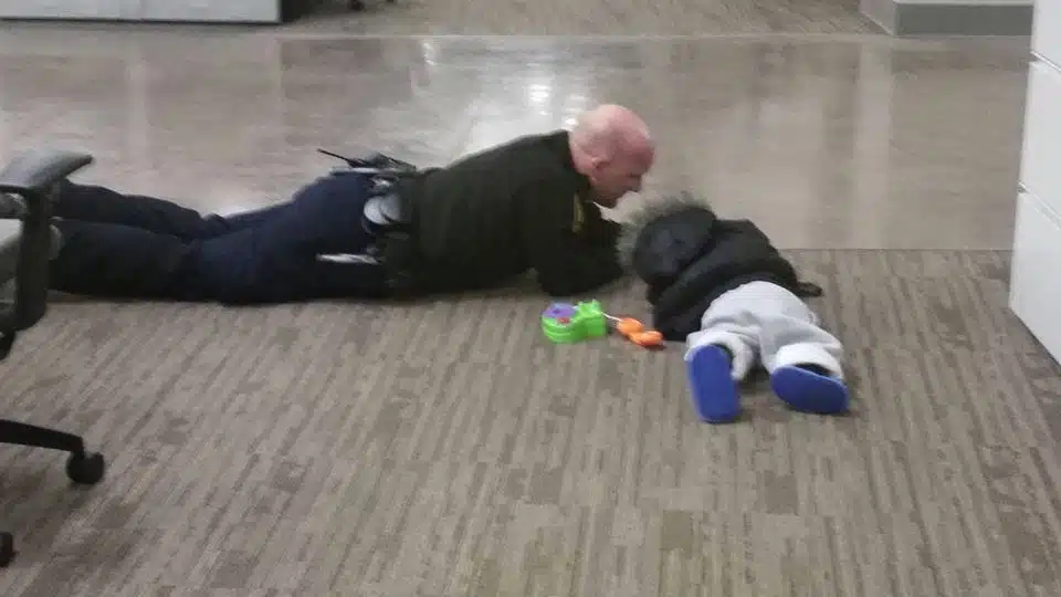 Ohio Officer Will Nastold comforts a toddler that was found wandering the streets