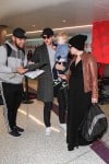 Pregnant Ginnifer Goodwin & Josh Dallas depart LAX with their Son Oliver