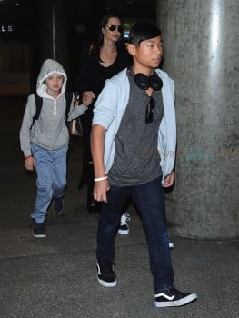 Angelina Jolie and her kids Pax, Shiloh & Zahara are spotted arriving on a flight at LAX airport