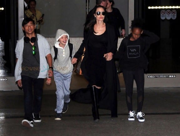 Angelina Jolie and her kids Pax, Shiloh and Zahara are spotted arriving on a flight at LAX airport