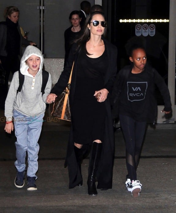 Angelina Jolie and her kids Pax, Shiloh and Zahara are spotted arriving on a flight at LAX airport