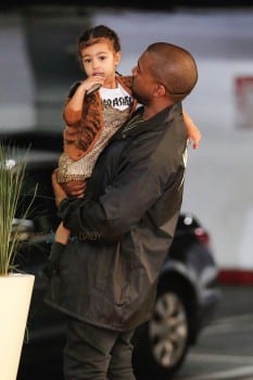 Kanye West Carries his daughter North West as they head in to the mall