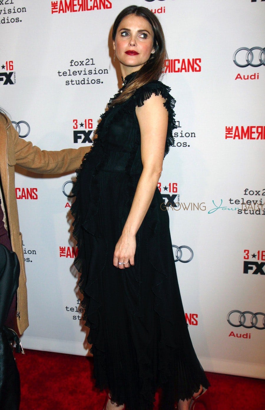 Mom-to-be Keri Russell walks the red carpet for the premiere of 'The Americans