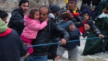 Syrians crossing river