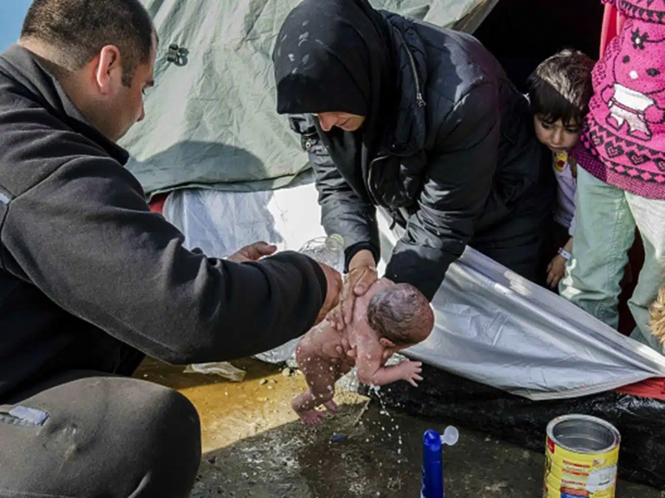 The Syrian baby boy Bayan was photographed being washed