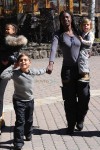 A nanny carries Penelope Disck with out in Vail with Mason Disick and North West