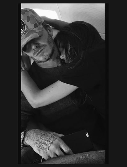 David and Victoria Beckham airplane cuddle