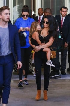 Kourtney Kardashian carries daughter Penelope after a trip to the LCMA