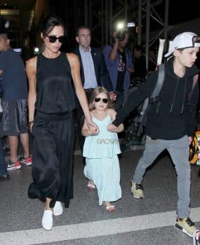 Victoria Beckham at the airport with kids Harper, Cruz and Romeo