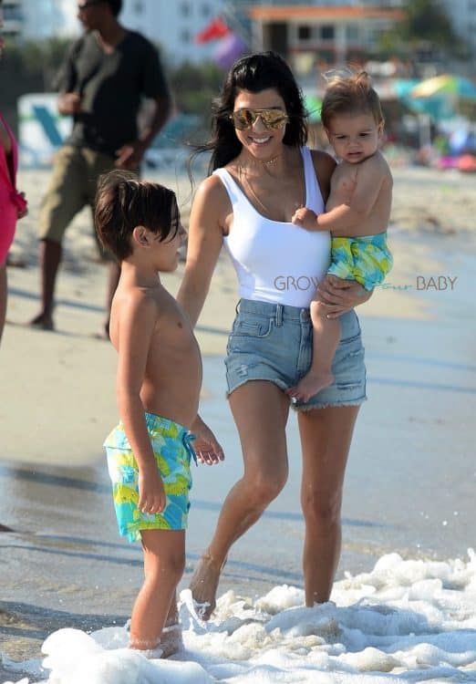 KOurtney Kardashian at the beach in Miami with kids Mason and Reign Disick
