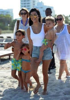 KOurtney Kardashian at the beach in Miami with kids Penelope Mason and Reign Disick