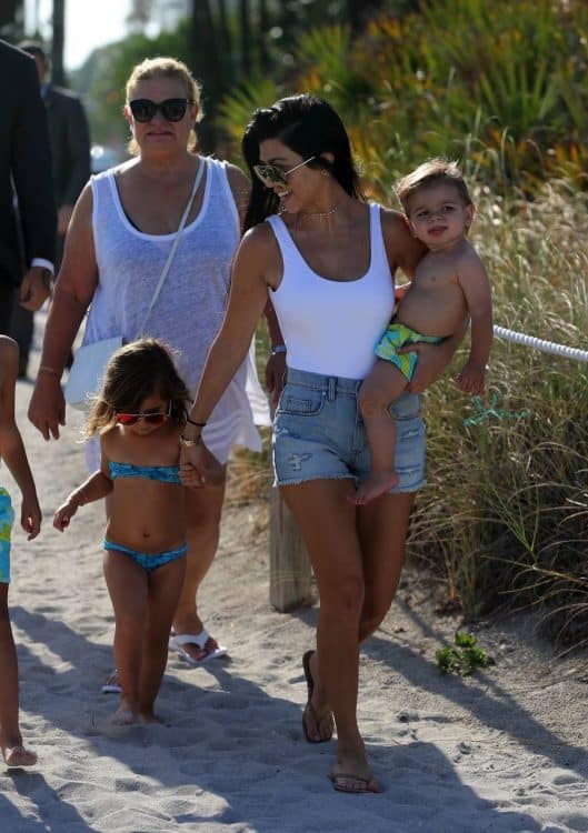 KOurtney Kardashian at the beach in Miami with kids Penelope and Reign Disick