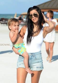 KOurtney Kardashian at the beach in Miami with son Reign Disick
