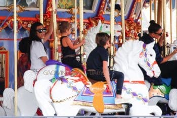 Kourtney kardashian rides the carousel with kids mason and Penelope