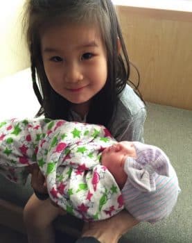 Big sister Jett with new baby Ray Ling Song