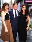 Kathryn Hahn, Robert Simonds and a pregnant Mila Kunis ring the closing bell