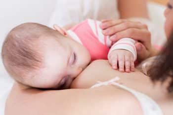 6 month-old baby breastfeeding