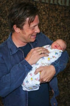 Jamie Oliver Craddles his baby boy outside the hospital