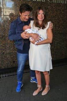 Jamie and Jules Oliver show off their baby boy outside the hospital