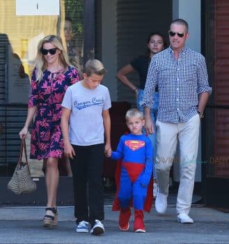 Reese WItherspoon and Jim Toth with sons Deacon and Tennessee at church