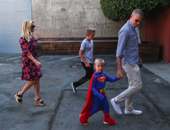 Reese WItherspoon and Jim Toth with sons Deacon and Tennessee at church