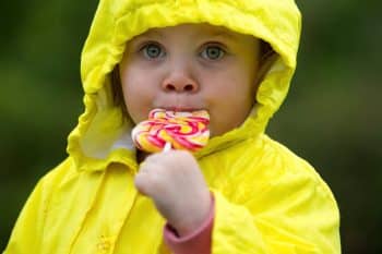 little girl eating candy