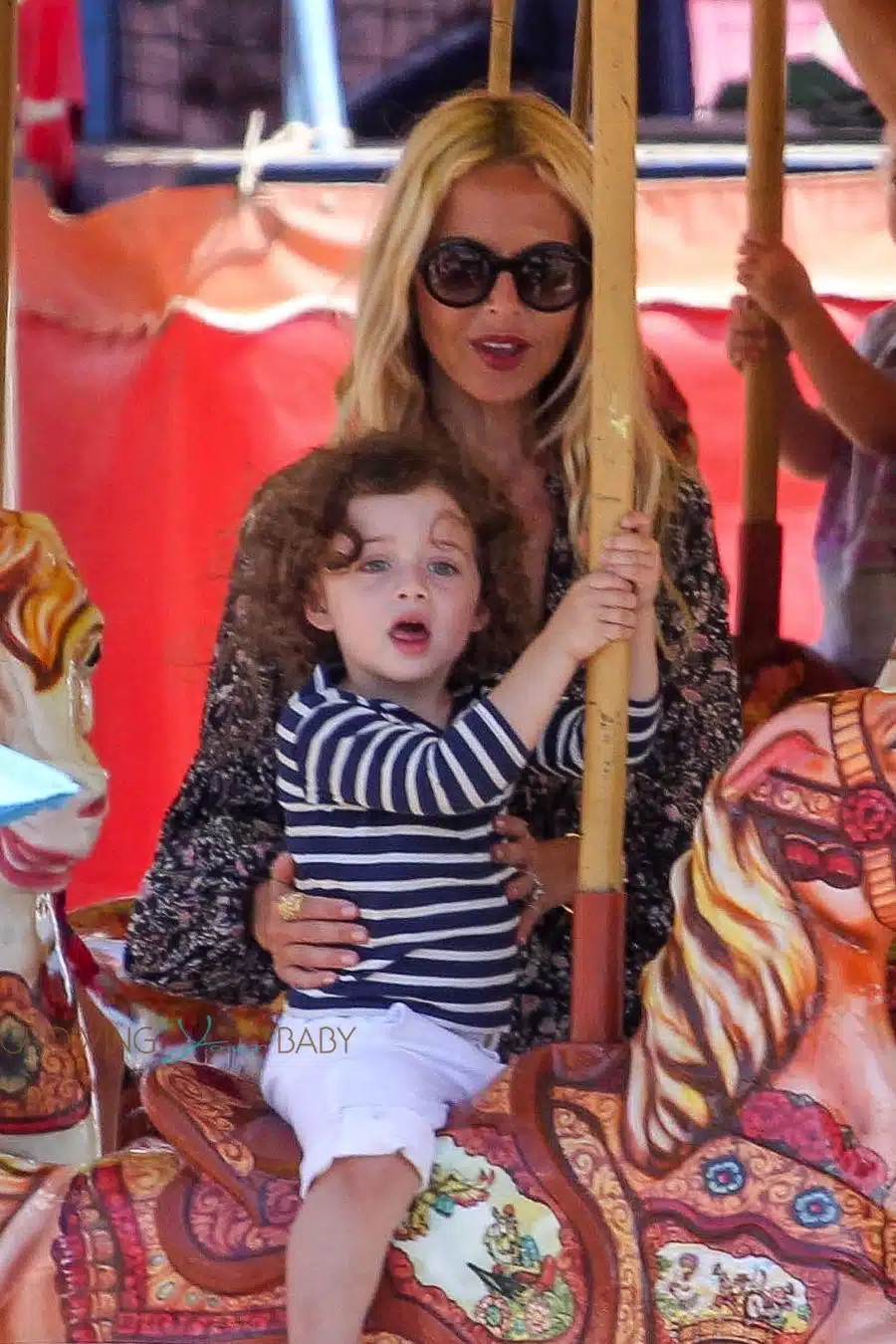 Rachel Zoe with son Kai on the carousel at the malibu Chili Cook out