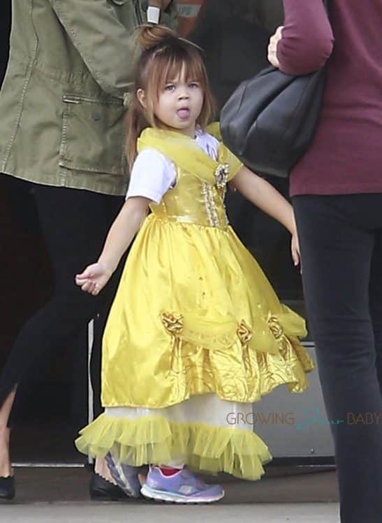 Everly was wearing a yellow Disney princess dress while out with her mother. 