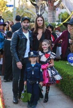 Alessandra Ambrosio and Jamie Mazur posed for photos with their kids Anja and Noah as they collected some treats In Santa Monica.