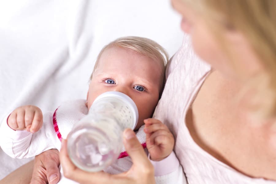 mom feeding baby