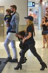 Shakira and Gerard Pique arrive at the Miami airport with their kids