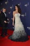 George Clooney and a pregnant Amal Clooney attend the photocall for Caesar's Film awards looking elegant together