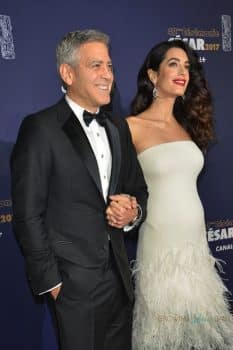George Clooney and a pregnant Amal Clooney attend the photocall for Caesar's Film awards looking elegant together
