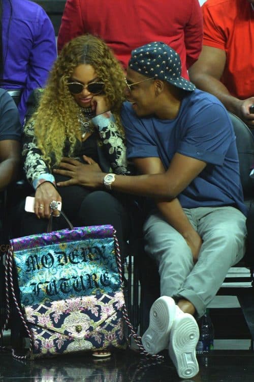 A very pregnant Beyonce and Jay Z sit courtside at the Clippers game