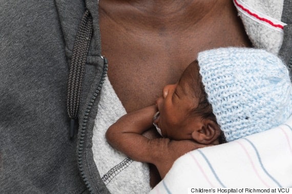 Ajibola Taiwo holds one of her sextuplets on May 23, 2017