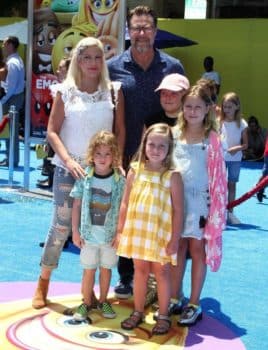 Tori Spelling and Dean McDermott at emoji movie premiere with kids Liam, Stella, Finn and Hattie