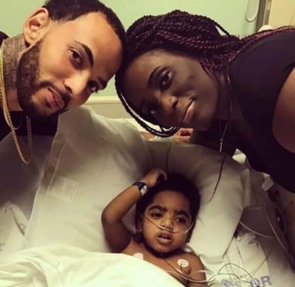 Two-year-old A.J. Burgess with his parents, Carmellia Burgess and Anthony Dickerson.