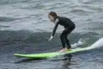 Faith Urban learns how to surf in Australia
