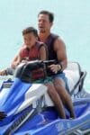 Mark Wahlberg take the jet ski out in Barbados with his son