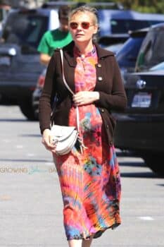Pregnant Kirsten Dunst shows off her growing baby bump while out grabbing groceries