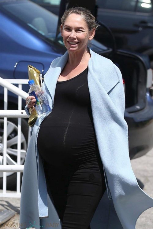 Ballroom dancer Kym Johnson is all smiles as she leaves a dance studio in Santa Monica showing off a growing baby bump with twins.